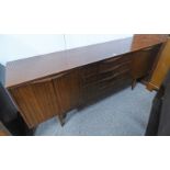 TEAK SIDEBOARD WITH 4 CENTRALLY SET DRAWERS FLANKED BY 2 PANEL DOORS TO EITHER SIDE OPENING TO