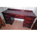 MAHOGANY KNEEHOLE DESK WITH CENTRALLY SET DRAWER AND 2 SETS OF 3 DRAWERS TO EITHER SIDE.