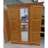 PINE MIRROR DOOR WARDROBE WITH PANEL DOOR TO EITHER SIDE .