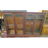 PINE BOOKCASE WITH 4 GLASS PANEL DOORS AND SHELVED INTERIOR,