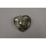 GEORG JENSEN DANISH SILVER BROOCH IN THE FORM OF A BIRD SET WITHIN A HEART - 4CM WIDE