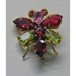 YELLOW METAL INSECT BROOCH SET WITH GARNETS & CHRYSOLITE