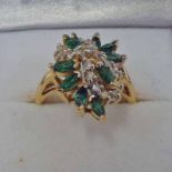 18K GOLD EMERALD & DIAMOND CLUSTER DRESS RING Condition Report: Ring size: M.