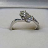 PLATINUM SET 2-STONE DIAMOND SET RING IN TWIST SETTING APPROX. 0.