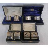 4 CASED SETS OF 2 SILVER NAPKIN RINGS,