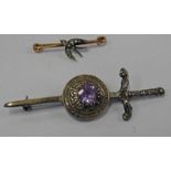 EARLY 20TH CENTURY GOLD DIAMOND SWALLOW BROOCH & A SCOTTISH SILVER AMETHYST SET LONG SWORD BROOCH