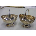 Lot Withdrawn PAIR OF SILVER SWING HANDLE BASKETS WITH SPURIOUS MARKS - WEIGHT 18.