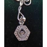 18K WHITE GOLD DIAMOND SET OCTAGONAL PENDANT ON 9CT WHITE GOLD CHAIN