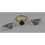 BLUE CABOCHON RING SET IN A YELLOW METAL MOUNT & A PAIR OF GEM SET EAR CLIPS