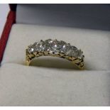 19TH CENTURY 5 STONE DIAMOND SET RING IN A SCROLL MOUNT MARKED 18CT.