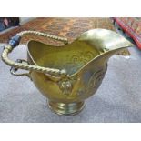 BRASS SWING HANDLED COAL SCUTTLE WITH EMBOSSED DECORATION