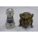 GLASS BONZO INKWELL 9CM TALL AND A BRASS ORIENTAL INKWELL