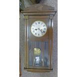 AN OAK ARTS & CRAFTS STYLE WALL CLOCK Condition Report: Once wound the clock keeps