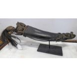 BATAK CARVED HORN WITH CARVED WOODEN STOPPER OF A CHIEF WITH HAIR HEADDRESS ON A ELEPHANT 46CM LONG