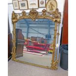 DECORATIVELY FRAMED MIRROR WITH HEADS TO THE CORNERS 175CM TALL X 162CM WIDE Condition
