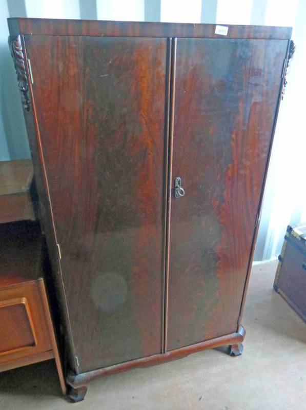 MAHOGANY WARDROBE WITH 2 DOORS OPENING TO FITTED INTERIOR .