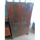 MAHOGANY WARDROBE WITH 2 DOORS OPENING TO FITTED INTERIOR .