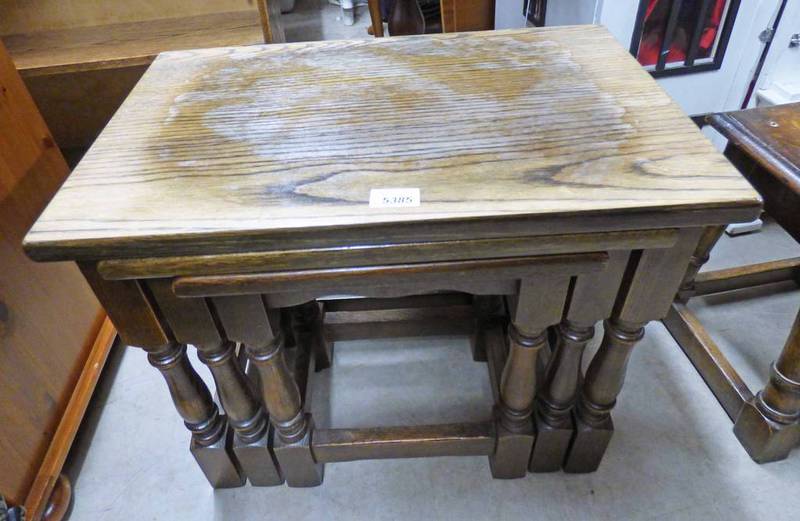 20TH CENTURY OAK NEST OF 3 TABLES Condition Report: The largest table has extensive