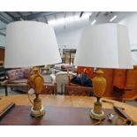 PAIR OF TABLE LAMPS ON CIRCULAR BRASS BASES DECORATED WITH CLASSICAL SCENES