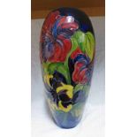 LARGE MOORCROFT VASE WITH HIBISCUS PATTERN ON DARK BLUE GROUND AND PAPER LABEL TO BASE - 37 CM TALL