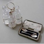 SILVER PLATED & CUT GLASS 4 PIECE CONDIMENT SET ON A SILVER PLATED STAND & A CASED PAIR OF SILVER