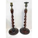 PAIR OF OAK BARLEY TWIST CANDLE STICKS WITH EMBOSSED METAL TIPS