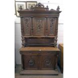 CABINET WITH 3 PANEL DOORS WITH CARVED DECORATION OVER 2 DRAWERS WITH 2 PANEL DOORS BELOW