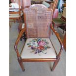 EARLY 20TH CENTURY MAHOGANY BERGERE ARMCHAIR ON SQUARE TAPERED SUPPORTS