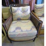 LATE 19TH CENTURY MAHOGANY BERGERE ARMCHAIR ON TURNED SUPPORTS
