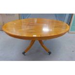 YEW OVAL COFFEE TABLE ON CENTRAL COLUMN WITH FOUR SPREADING LEGS WITH METAL PAWS LENGTH 117CM