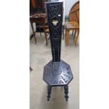 EARLY 20TH CENTURY EBONISED DECORATIVELY CARVED SPINNING CHAIR HEIGHT 97CM