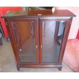 MAHOGANY CABINET WITH 2 GLAZED PANEL DOORS ON SQUARE SUPPORTS LENGTH 81CM