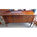LATE 19TH CENTURY MAHOGANY SIDEBOARD WITH 3 DRAWERS FLANKED BY 2 PANEL DOORS ON SHAPED SUPPORTS
