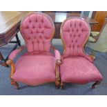 PAIR OF MAHOGANY FRAMED CHAIRS ON SHAPED SUPPORTS WITH PINK BUTTONS,