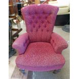 LATE 19TH CENTURY BUTTON BACK ARMCHAIR ON TURNED SUPPORTS