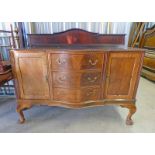 EARLY 20TH CENTURY WALNUT SIDEBOARD WITH SHAPED FRONT OF 3 DRAWERS AND 2 PANEL DOORS ON BALL AND
