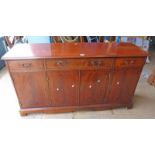 MAHOGANY SIDE CABINET WITH 3 DRAWERS OVER 4 PANEL DOORS ON BRACKET SUPPORTS LENGTH 151CM