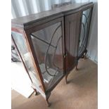 MAHOGANY BOW FRONT DISPLAY CASE ON BALL AND CLAW SUPPORTS