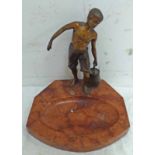 EARLY 20TH CENTURY METAL FIGURE OF A BOY CARRYING A PAIL OF WATER ON A HARDSTONE BASE,