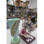 GREEN POTTERY TABLE LAMP ON CIRCULAR BASE AND CAP DE MONTE PORCELAIN FIGURE OF FLORENCE ON MAHOGANY