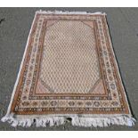 CREAM GROUND MIDDLE EASTERN RUG,