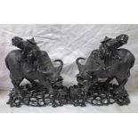 PAIR OF 19TH CENTURY CHINESE HARDWOOD CARVINGS OF BOYS RIDING BUFFALO'S ON HARDWOOD BASES - 22 CM