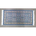 BLUE GROUND FLORAL DECORATED RUG 144 X 70 CM