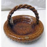 19TH CENTURY TREACLE GLAZED POTTERY BASKET WITH ROPE TWIST HANDLE & FRILLED EDGE - 23.
