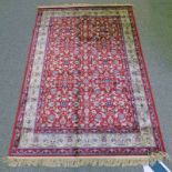 RED GROUND CASHMERE RUG WITH ALL OVER FLORAL PATTERN WITH UNIQUE GOLD BORDER 170 X 118CM