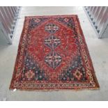 RED GROUND MIDDLE EASTERN CARPET 210 X 150 CM Condition Report: Age related marks