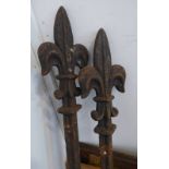 TWO CAST IRON POLES WITH FLEUR DE LIS FINIAL'S,