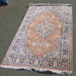 ORANGE GROUND FLORAL DECORATED RUG 188 X 128 CM Condition Report: Faded.