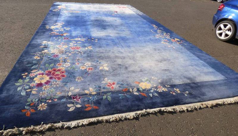 BLUE GRAND FLORAL DECORATED CARPET 442 X 720CM Condition Report: 362cm x 459cm.