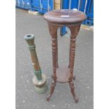 MAHOGANY POT STAND WITH BARLEY TWIST DECORATION ON SHAPED SUPPORTS AND CARVED WOODEN CANDLE STICK.